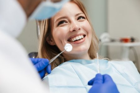 person smiling at dentist